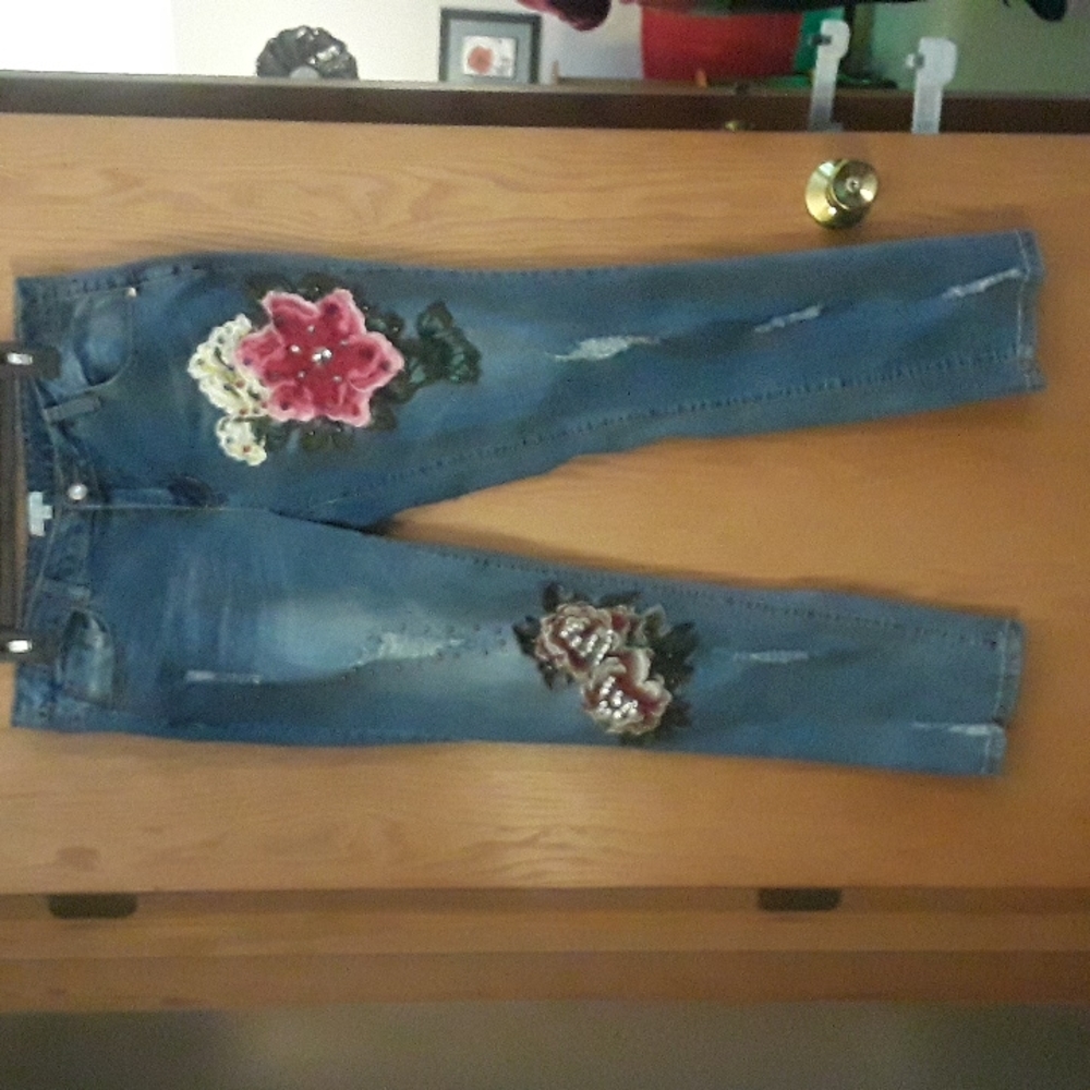 Jeans by Style size 10 with attached beautiful flowers. They look great on